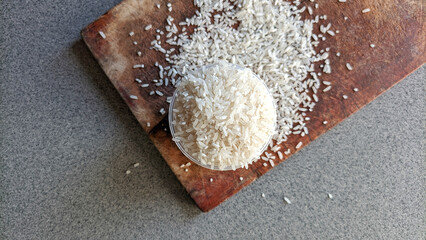 Selective focus of a collection of rice on cutting board. concept of zakat and alms