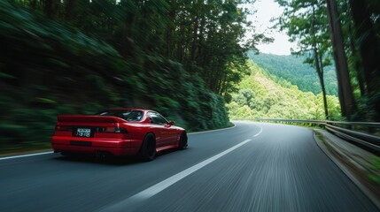 Speed Through the Mountains: A Red Sports Car on a Winding Road