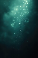 Naklejka premium A shimmering dark green background with soft bokeh effects and light particles.