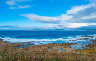 Wild shore with rocks and stones along the coast of northern Spain, Muxia, Galicia, September 12, 2024