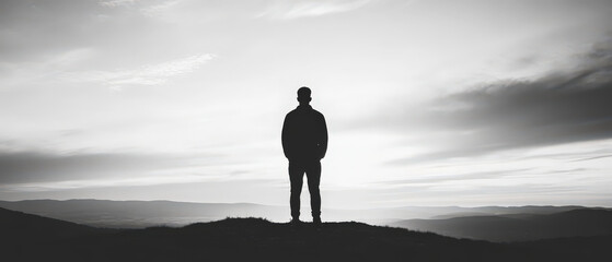 Tall Person in Black Silhouette Against Horizon