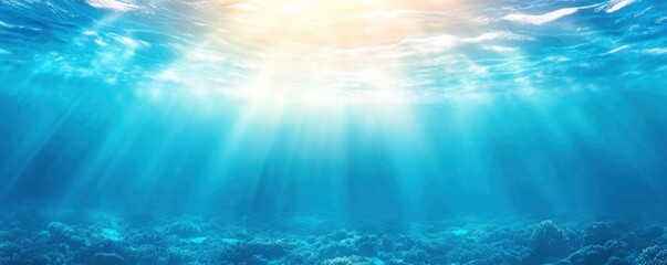 Obraz premium Blue ocean surface with coral reefs and sun rays coming from above