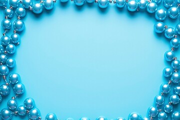 Fototapeta premium Light Blue Christmas Ornaments Border on Blue Background