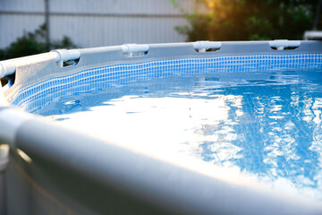 Above ground swimming pool outdoors on sunny day, closeup