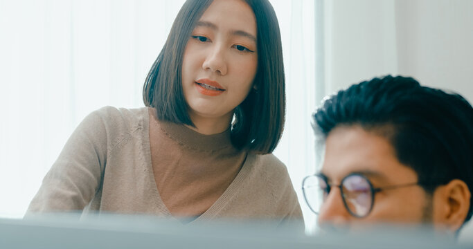 Closeup group Adult Asia male, female freelance meeting write prompt AI bot IT app smart program nomad, video game, talk strategy, discuss plan, user interface, designer, data center desktop computer.