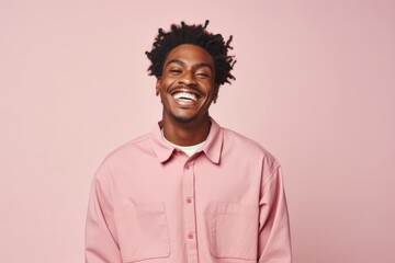 Fototapeta premium Portrait of a joyful afro-american man in his 20s sporting a breathable hiking shirt over pastel or soft colors background
