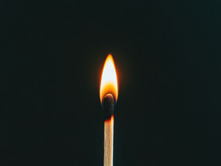 Bright Matchstick Flamed Against Dark Background
