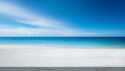 Fototapeta premium Concrete table top against the background of the sea on the beach. Empty white countertop for product presentation with blue water and sky. Outdoor mockup