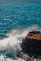 Waves crashing against a rocky cliff