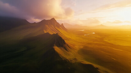 Peaceful sunrise over scenic mountain landscape with rolling hills and soft light.