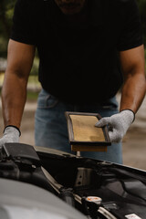 Mechanic Replacing Car Air Filter 