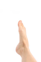 Obraz premium naked foot of a woman on a white background 