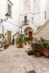 View of picturesque narrow, stone street typical of Mediterranean countries, Locorotondo, Italy, Apulia