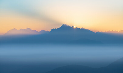 First Rays Of Sun Over The Dolomites From The Passo di Monte Giovo