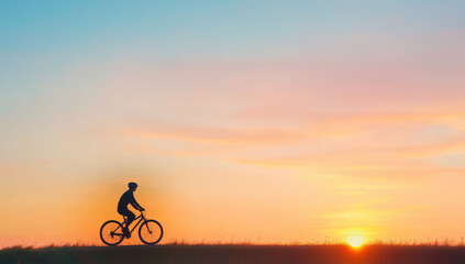 Cinematic silhouette of a cyclist riding during a vibrant sunset over a serene landscape capturing freedom and adventure