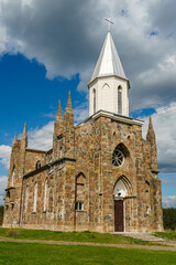 The Catholic church. The old red brick church. A historical building with a religious purpose.