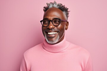 Obraz premium Portrait of a grinning afro-american man in his 50s dressed in a thermal insulation vest over solid pastel color wall