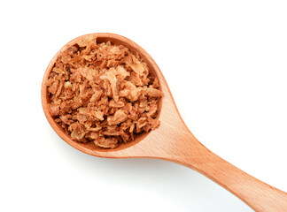 Dried fried onion flakes in wooden spoon