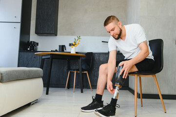 Man amputee with prosthetic leg disability on above knee transfemoral leg prosthesis artificial...
