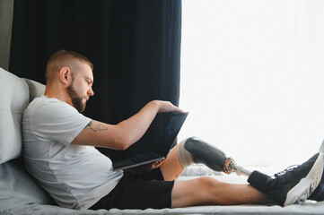 Man amputee with prosthetic leg disability on above knee transfemoral leg prosthesis artificial...