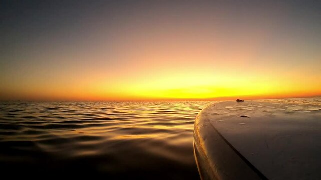 Stand up paddle board at sunset.  Recreation paddling sup surfboard.