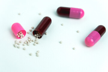 Pink and maroon pills broke balls