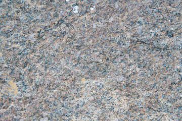 The texture of the granular granite in the photo shows a light stone with a fine granular structure