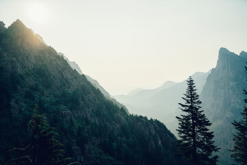 Dramatic Mountain Landscape in North Cascades, Washington – Misty Valleys, Rugged Peaks, and Soft Sunlight Over Baring Mountain Wilderness in the Pacific Northwest