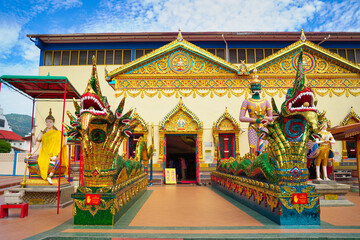 Guardian dieties,Deva and naga or dragon like figures outside the main entrance to the shrine at the Wat Chaiyamangkalaram Thai Theravada Buddhist temple built in 1845 in Georgetown,Penang,Malaysia