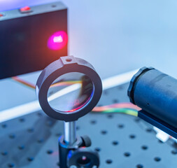 Experiment with laser device in optical laboratory