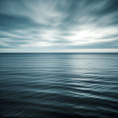 Obraz premium Tranquil Ocean Landscape with Dramatic Clouds