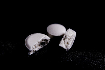 Pill on a dark black background