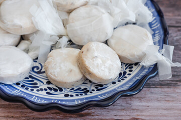 Traditional Christmas polvorones, nevaditos, mantecados or sweet cookies on plate fot holidays