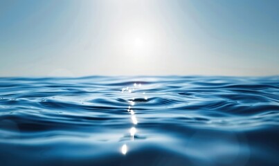 Naklejka premium Wide view of calm ocean with light reflections on the water surface and clear sky in the background. Tranquility and nature concept. Design for wallpaper, poster, and banner.