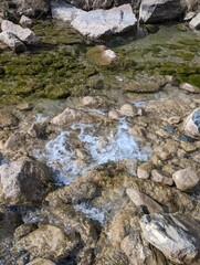 water flowing through rocks in the mountains