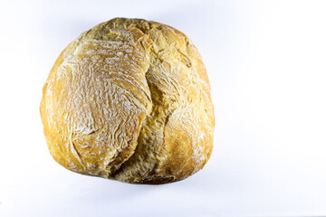 Fototapeta premium A freshly baked Portuguese carcaça bread on a clean white background, showcasing its golden crust and airy interior, perfect for food-related projects. 