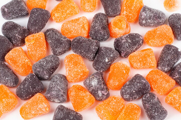 Halloween Candy Orange and Black Spice Drop Gummies Flat Lay Isolated on White