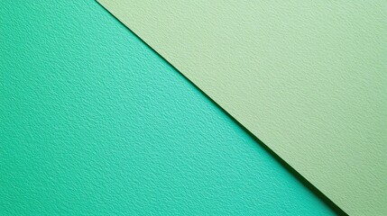 Diagonal division of textured and plain paper sheets forms line partitions Modern neo mint and green abstract dual tone background design Space for text Bird s eye view