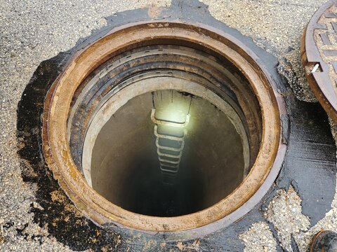 Open Manhole with Ladder Access