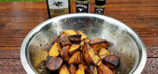 Roasted Seasoned Potatoes in Mixing Bowl