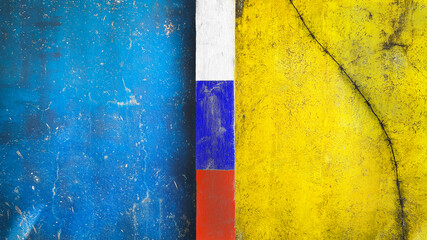 Symbol of war and separatism: a yellow-blue concrete wall with barbed wire and a white-blue-red...