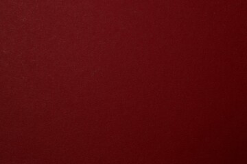 Red textured sheet background. Blank space for text