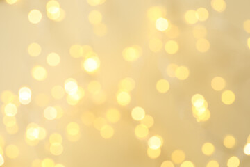 Golden blurred bokeh lights on color background. Glitter sparkle stars for celebrate. Overlay for your design