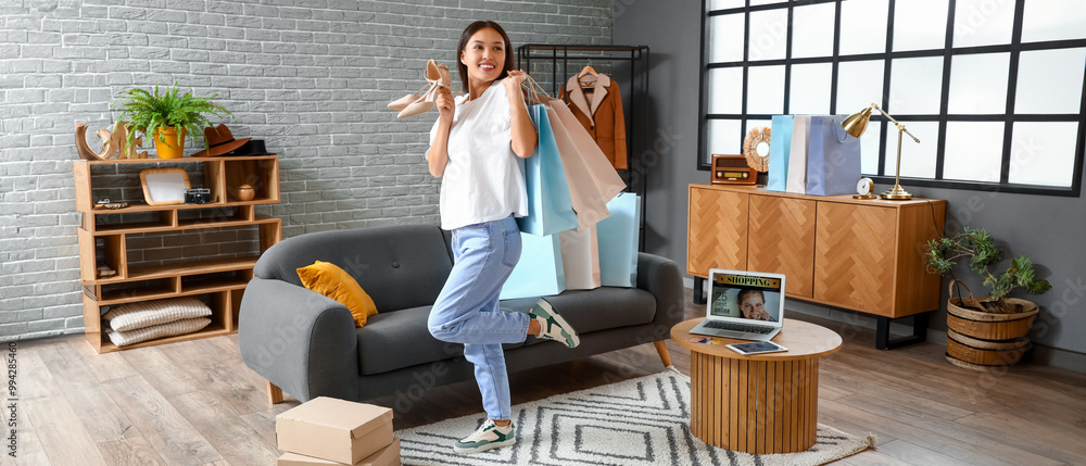 Sticker Young Asian woman with new heels and shopping bags at home