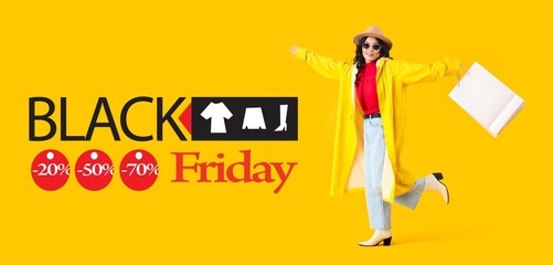 Stylish young Asian woman in autumn clothes and with shopping bags on yellow background. Black Friday sale