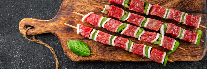 kebab raw meat vegetable pork, lard, pepper, vegetable dish fresh delicious gourmet food background on the table rustic food top view copy space
