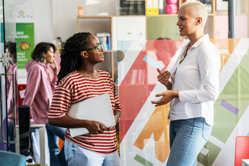 In a dynamic college campus lobby , a group of students brainstorming about education, culture, human rights, and race equality.	