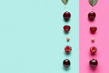 Sweet cherries with halves on colorful background