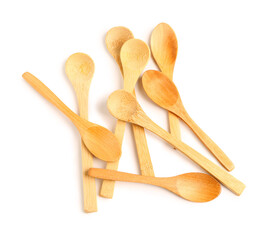 Heap of wooden spoons isolated on white background