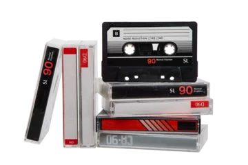 A stack of audio cassettes. Close-up of an audio cassette with a sticker without text.  Cassettes for audio recordings and music. Analog storage medium.